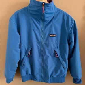 Patagonia water resistant blue bomber with synchilla purple lining